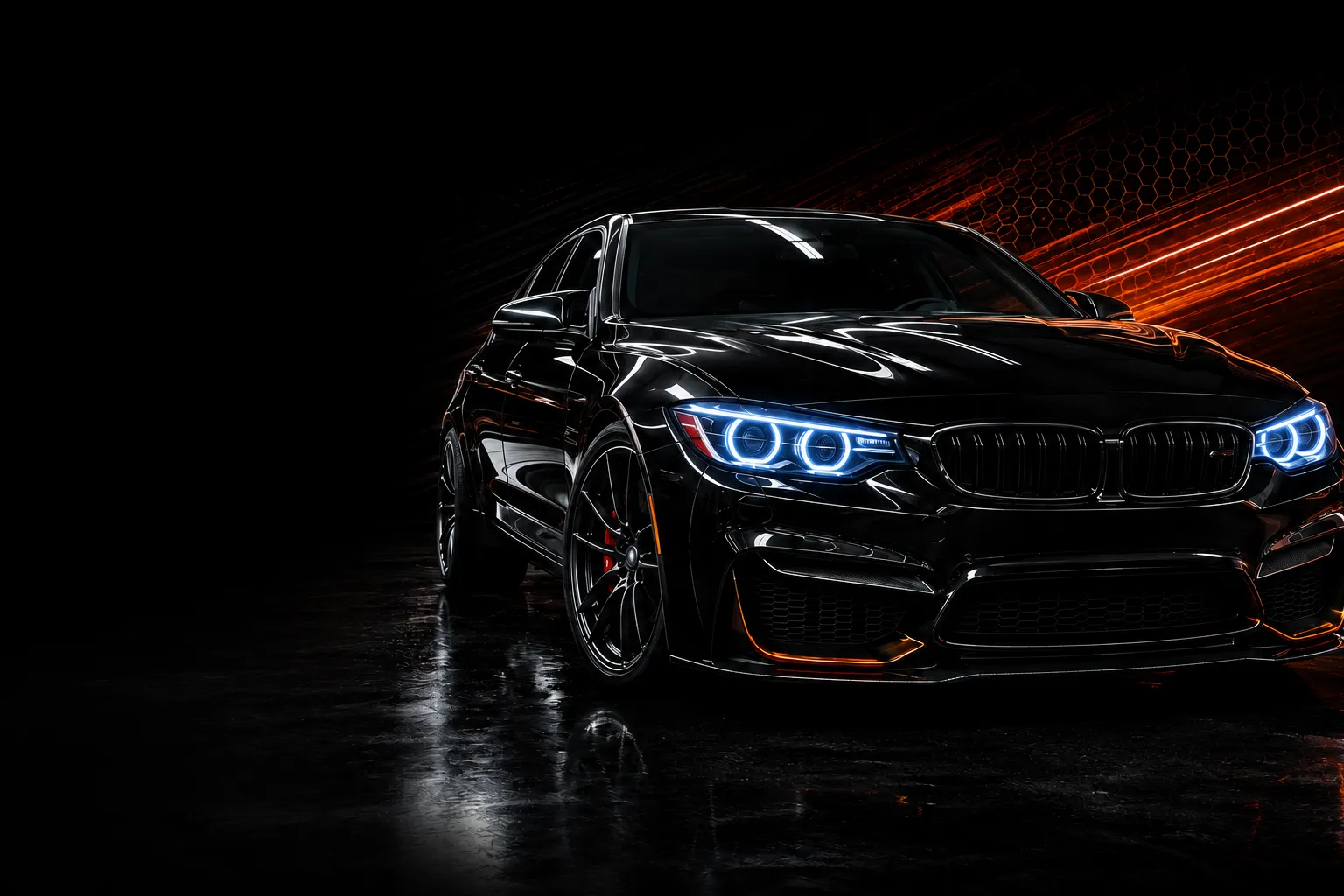 Freshly detailed black performance sedan in a dark studio